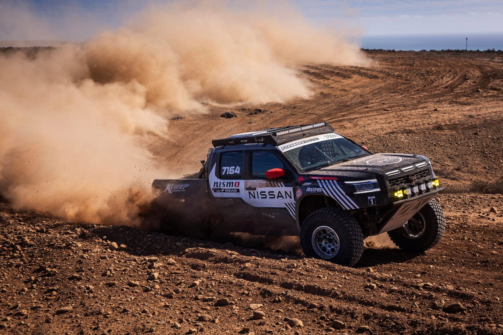 Forsberg Racing's Nissan Frontier throwing dust on a NORRA 500 stage