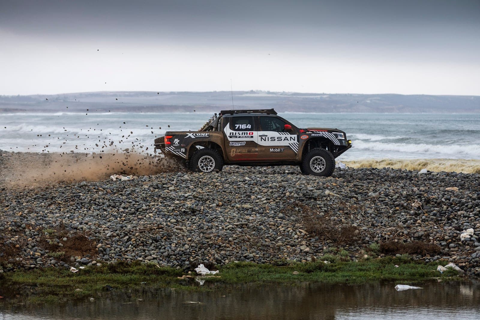 The Forsberg Racing Nissan Frontier beside the Baja shoreline