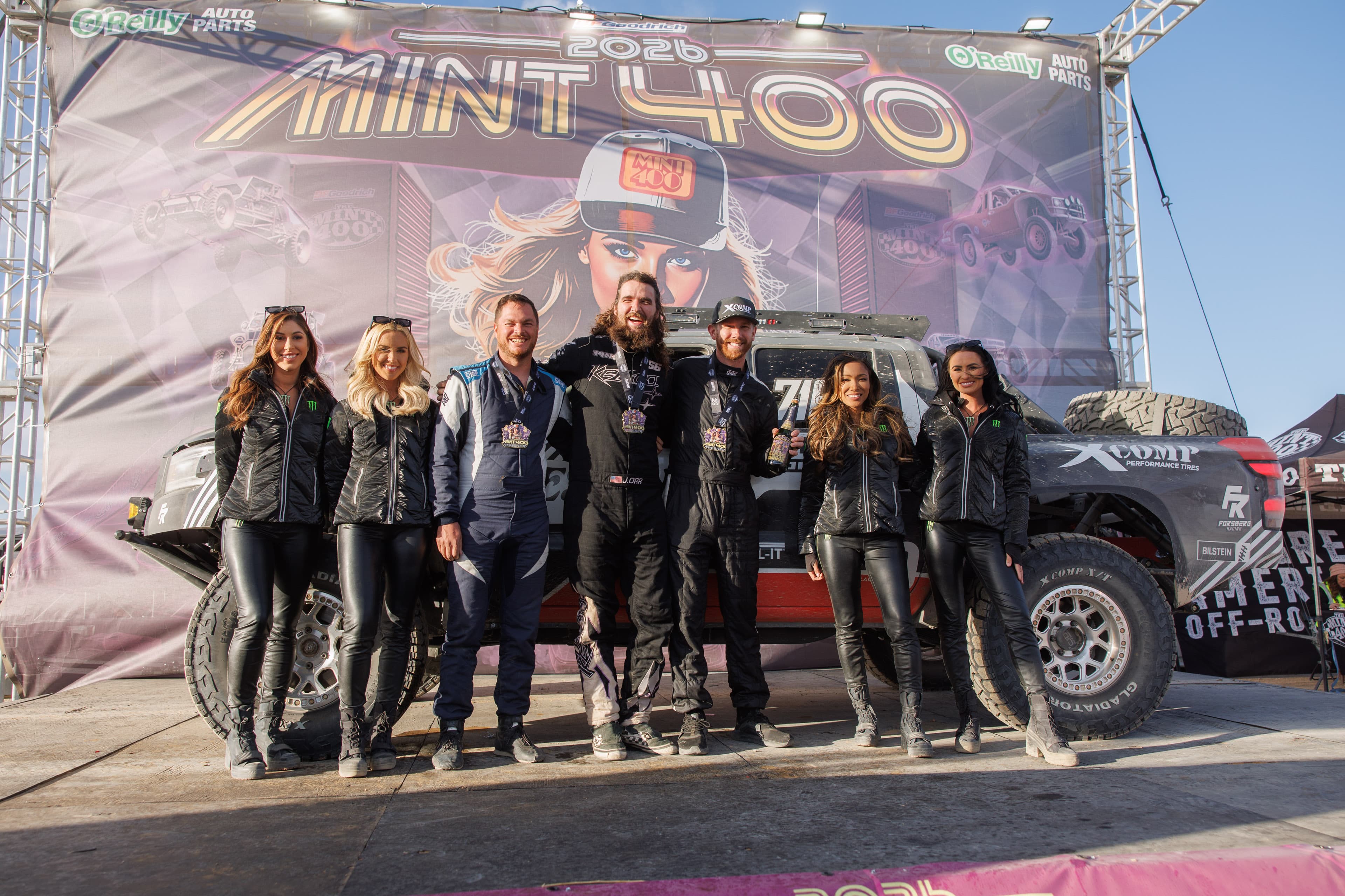 Forsberg Racing team celebrating a Class 7F win at The Mint 400 with the Nissan Frontier Forsberg Edition race truck